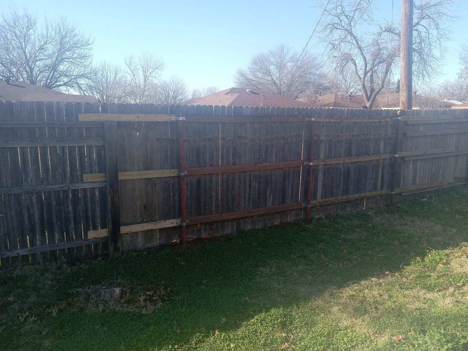 Image of our latest Residential Fence Repair, using salvaged fence picket to save 50% on costs! Can Mend and Match Any Fence Line With Used Materials.